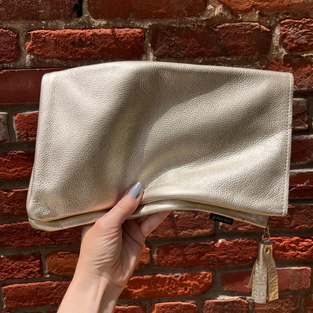 Zina Kao gold foldover clutch